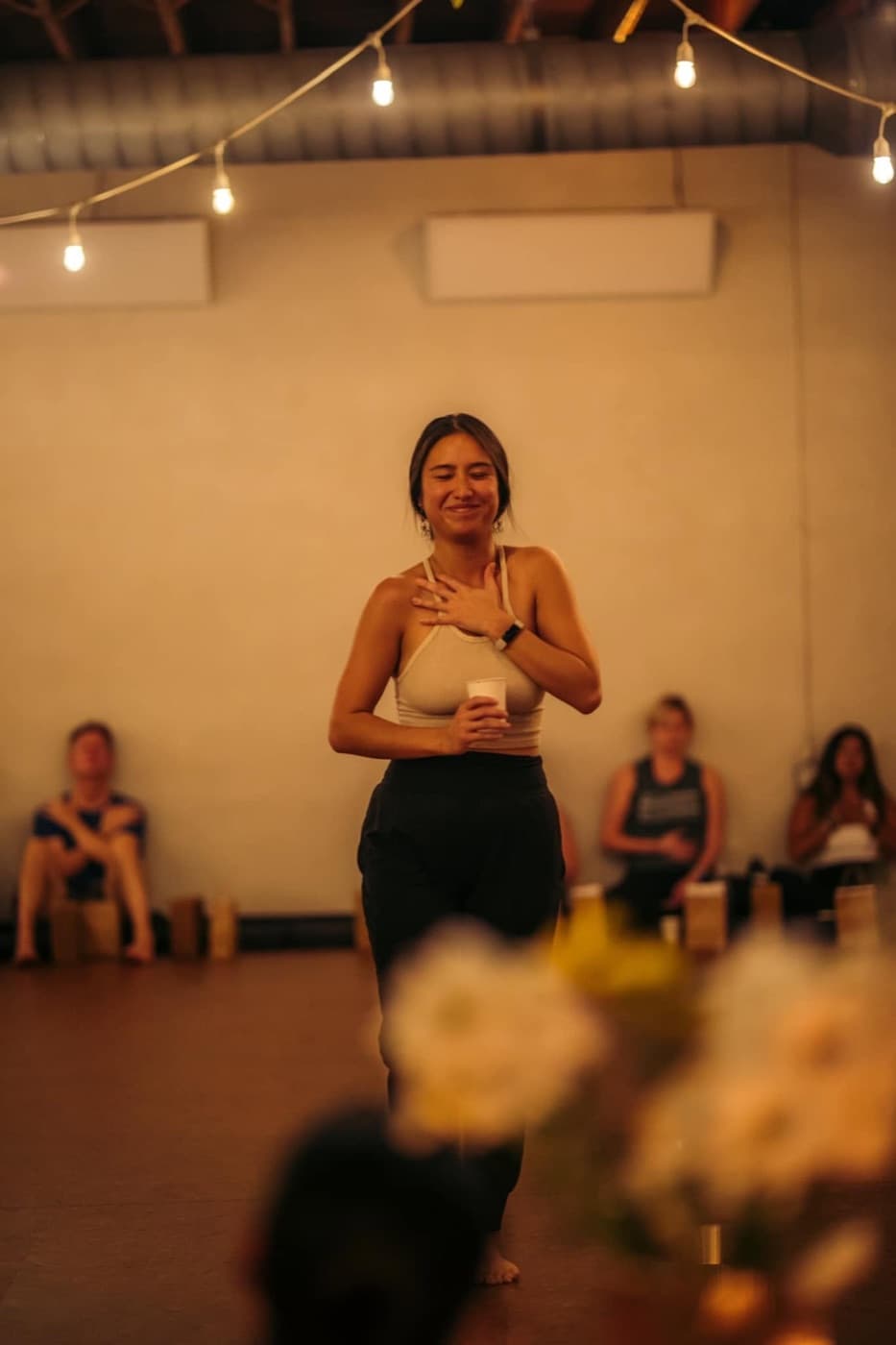 Ash Sumida addressing a seated room